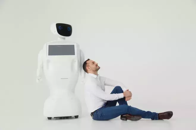business man leaning against ai robot pondering
