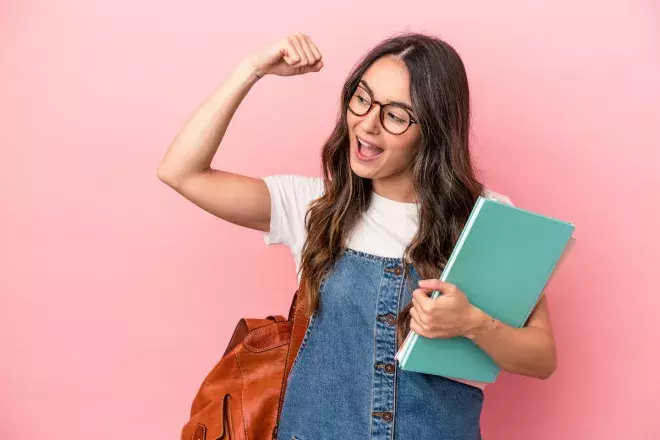 college student flexing arm