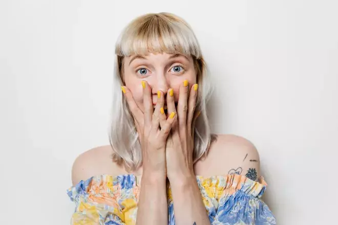 covering face with hands