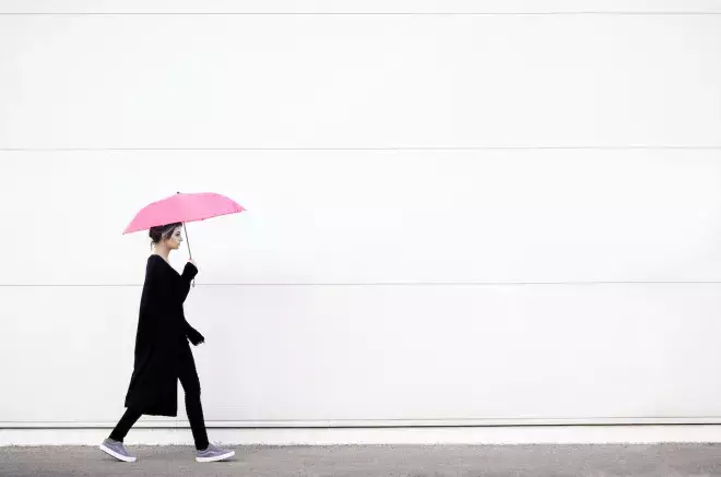 person walking with unbrella