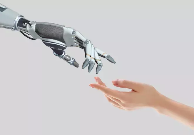 human hand and robot hand reaching towards each other
