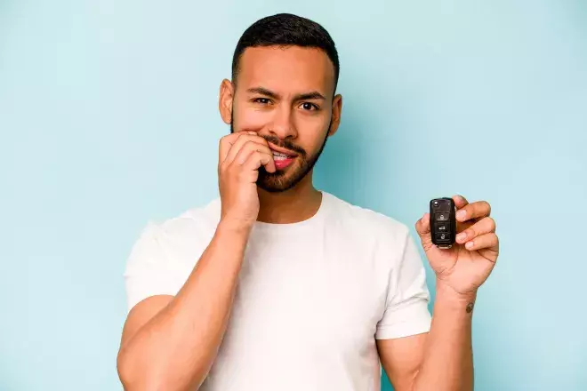 nervous person holding car keys