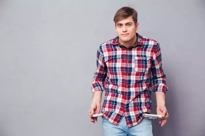 student pulling out empty pockets