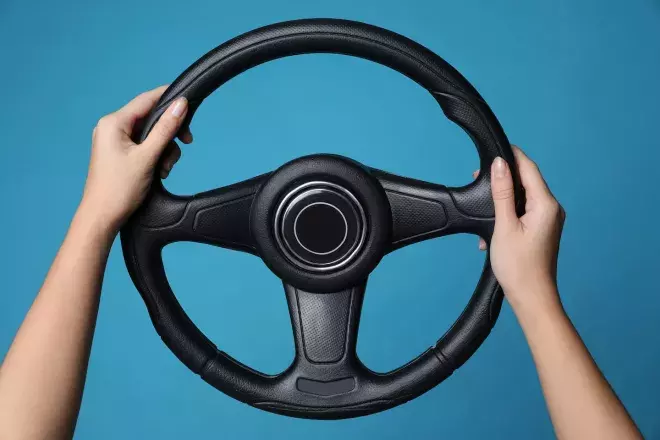 hands holding steering wheel