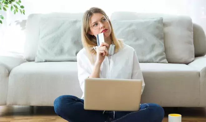 Woman Thinking Credit Card Laptop