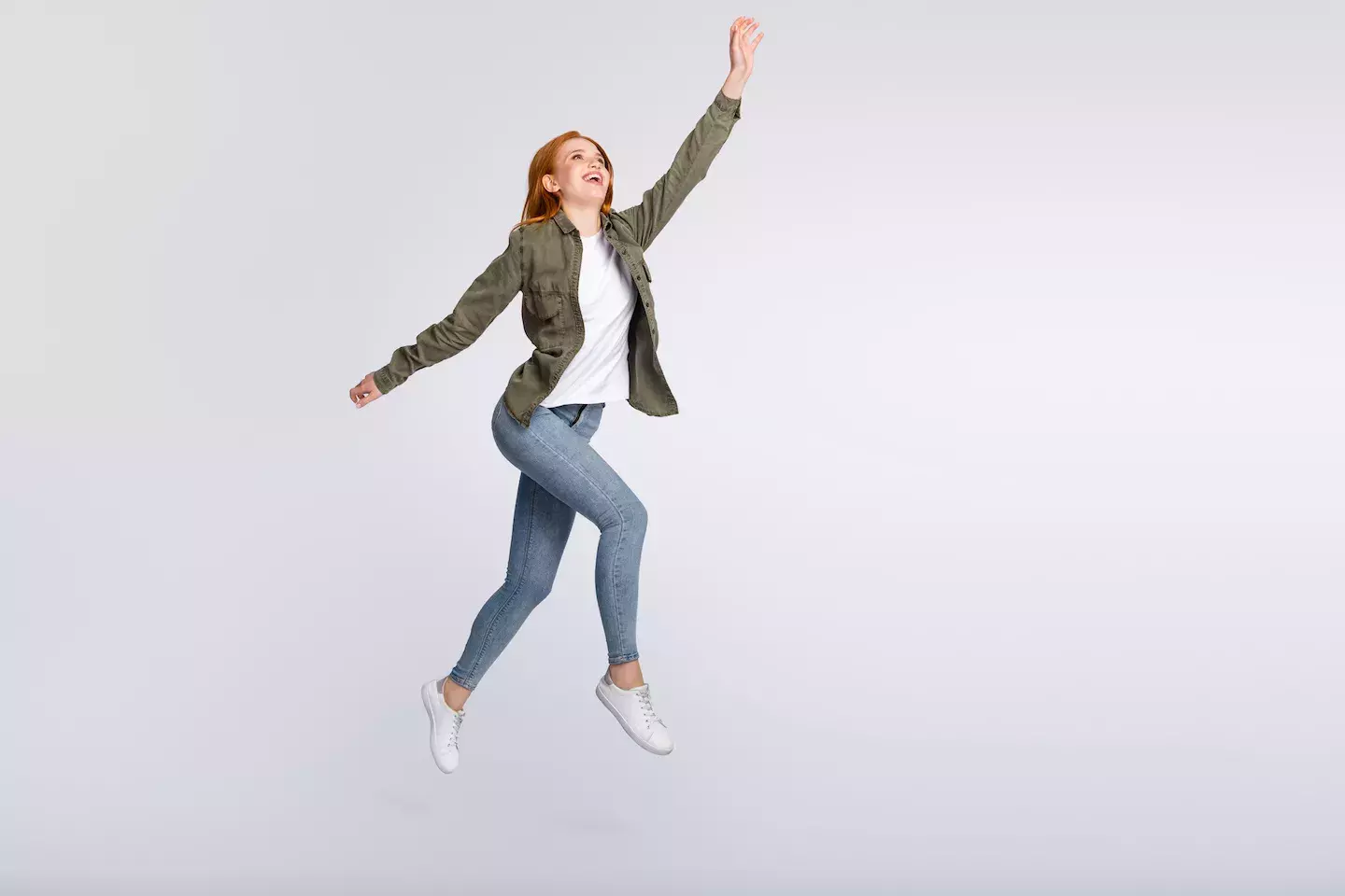 woman taking steps in mid air reaching up