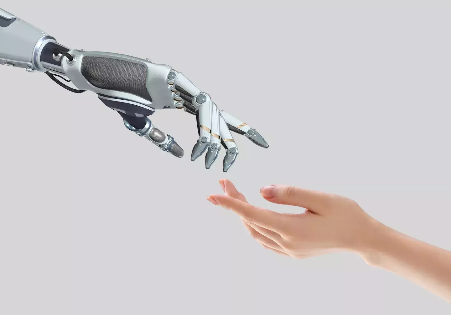 human hand and robot hand reaching towards each other