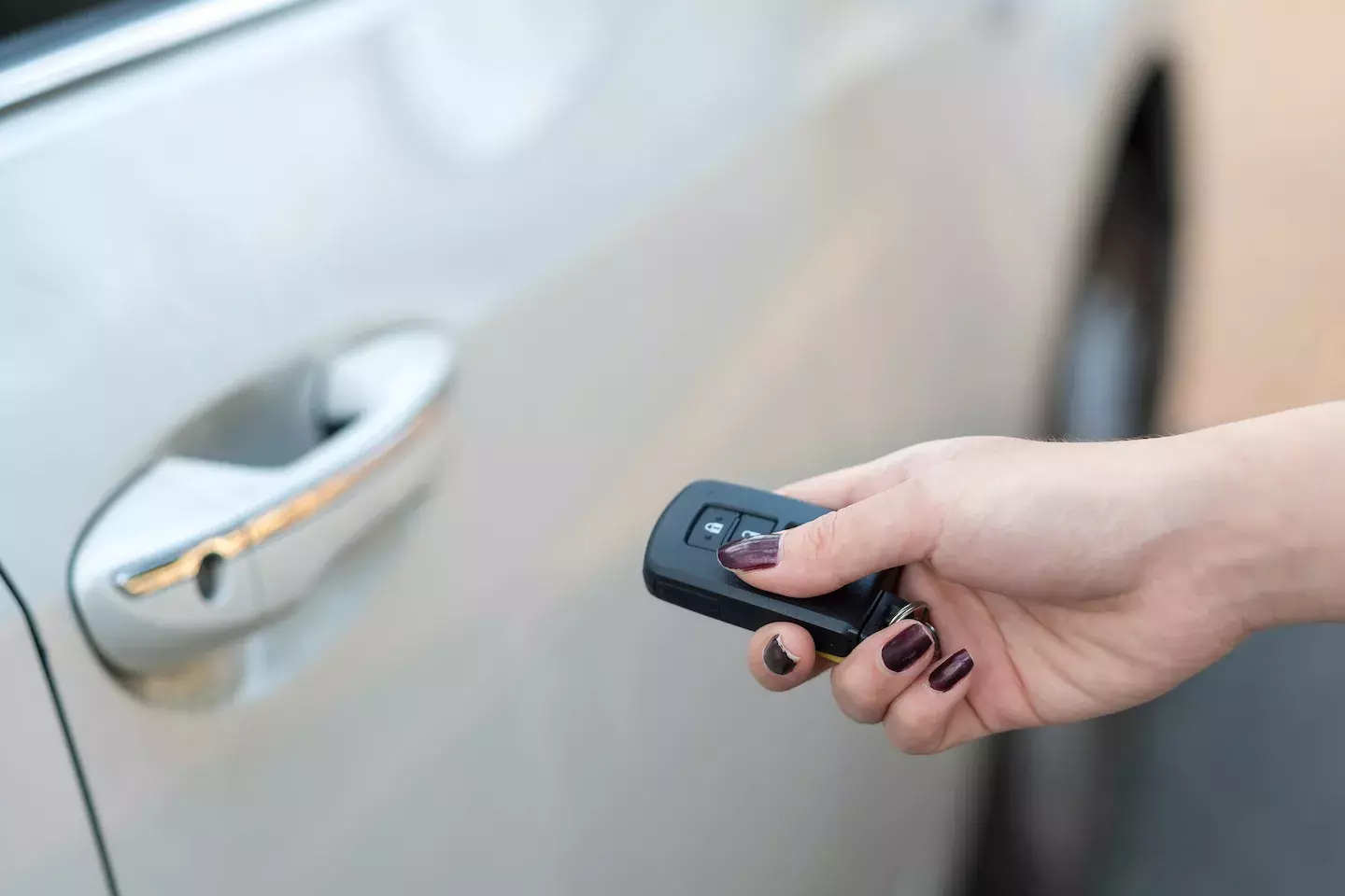 Hand holding car keys