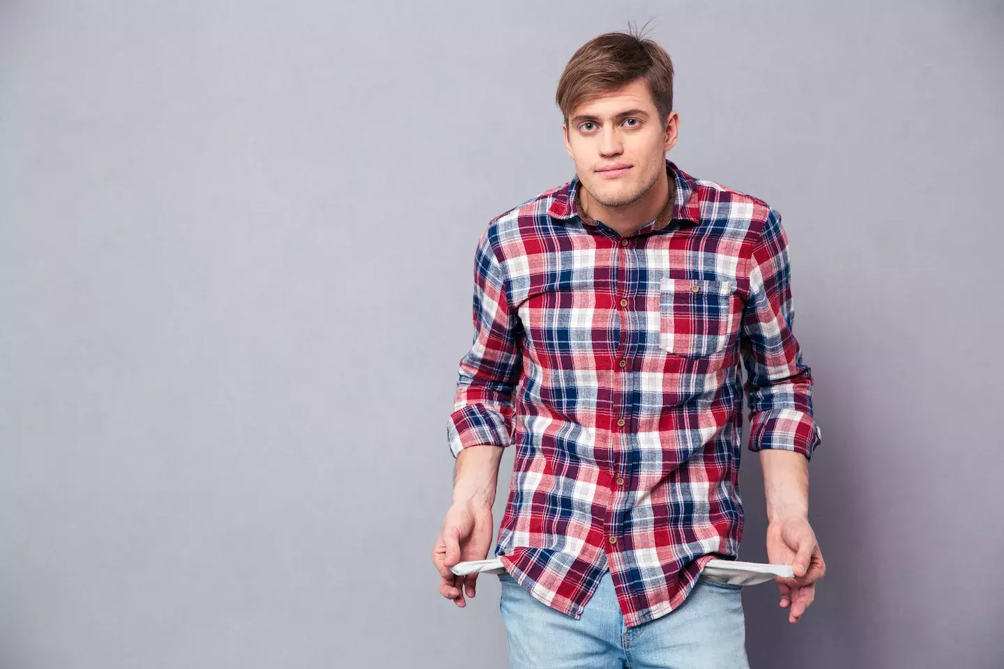 student pulling out empty pockets