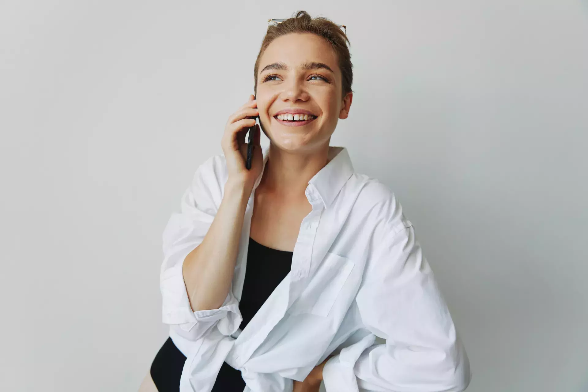 smiling person on cell phone