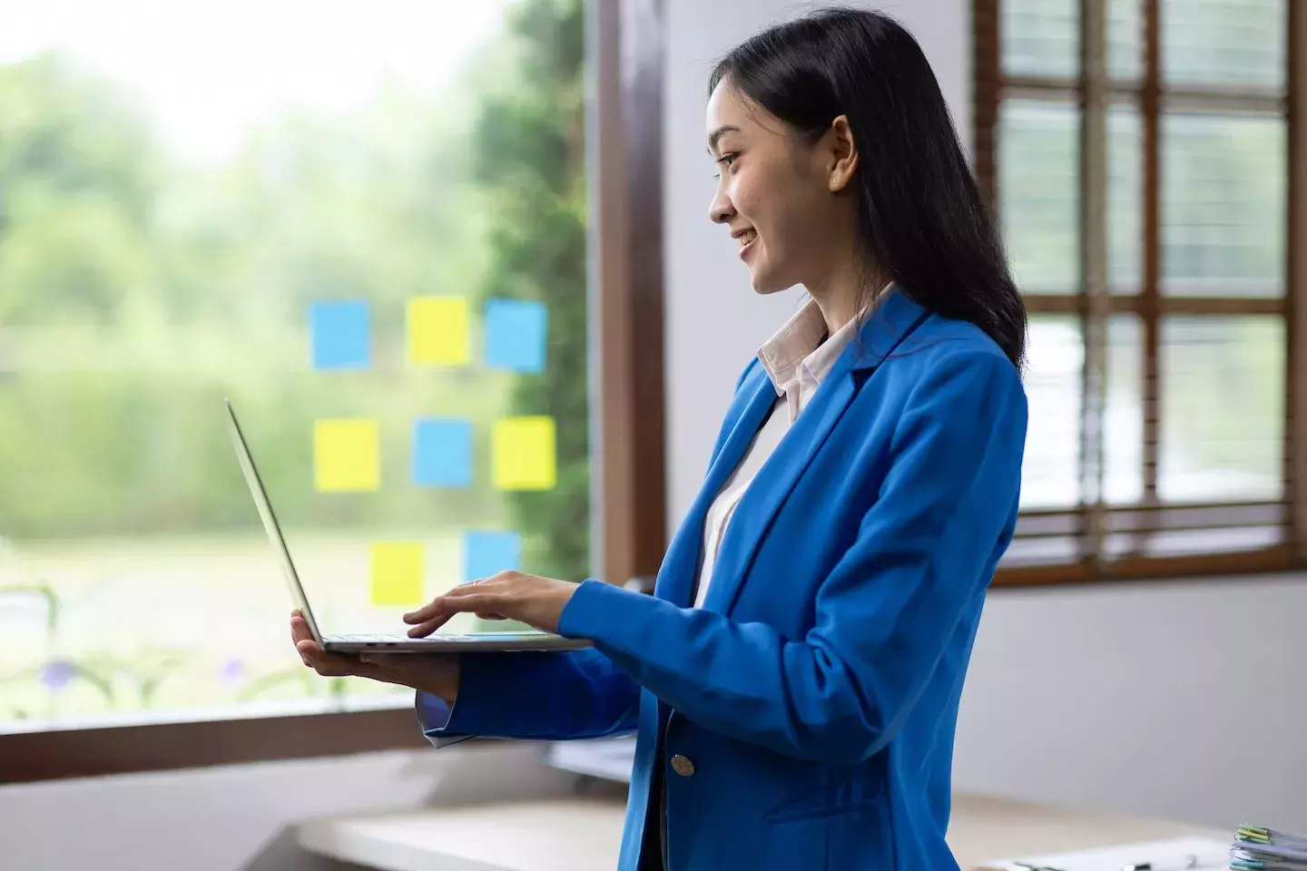 woman celebrating achievement at work