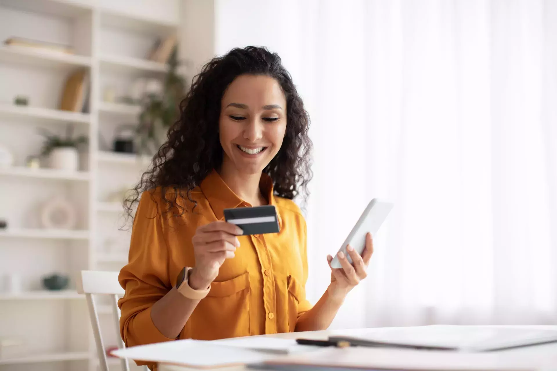 Woman with phone and card