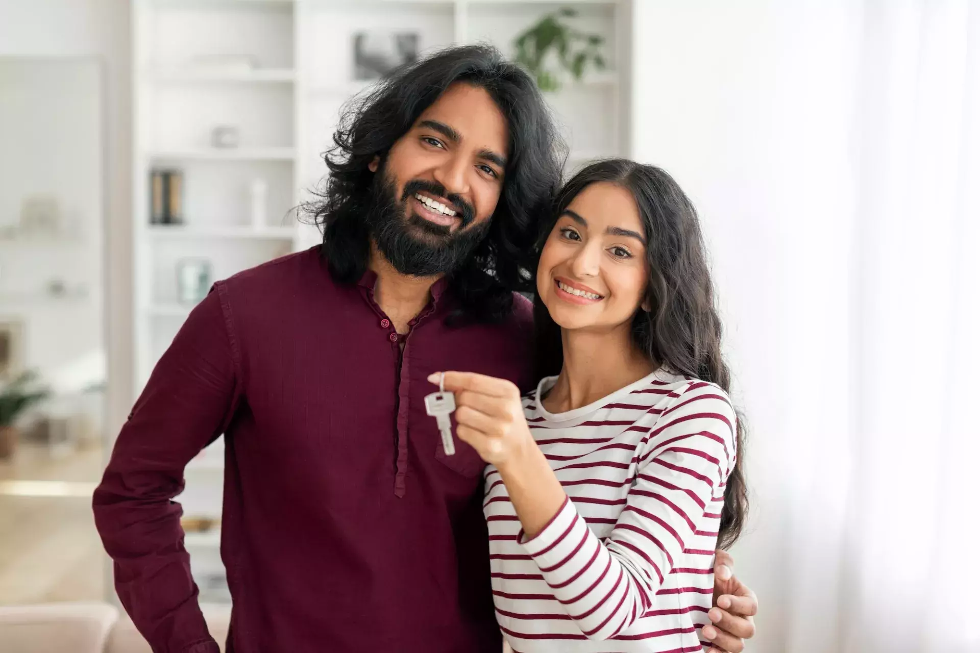 Couple with house keys