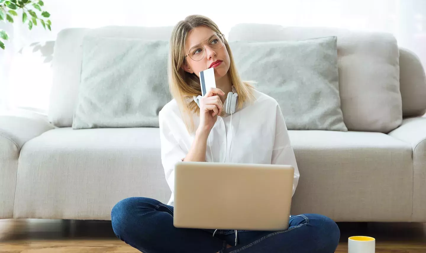Woman Thinking Credit Card Laptop