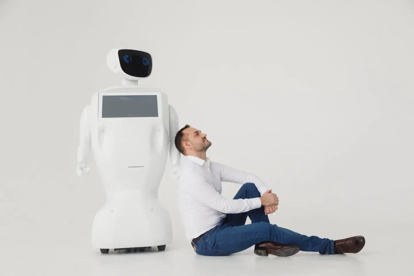 business man leaning on AI robot