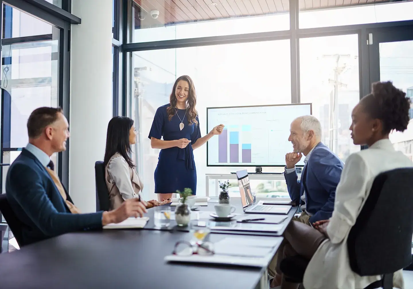 business meeting looking at data on presentation